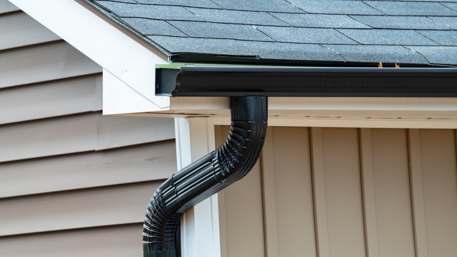 rain,gutter,of,roof,with,downpipe,new,metal,pipecorner